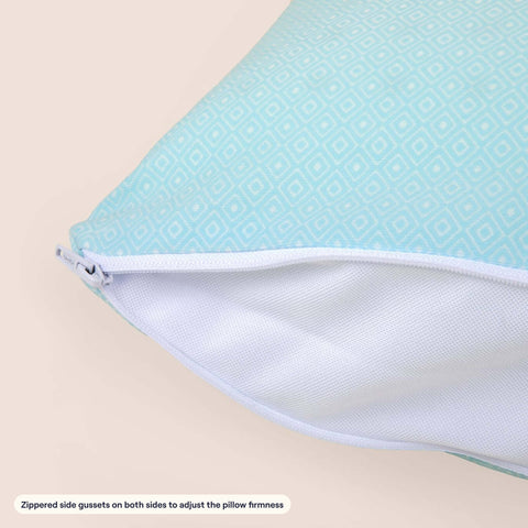 The zippered gusset on a Slumber Cloud Adjustable UltraCool Pillow on a cream background