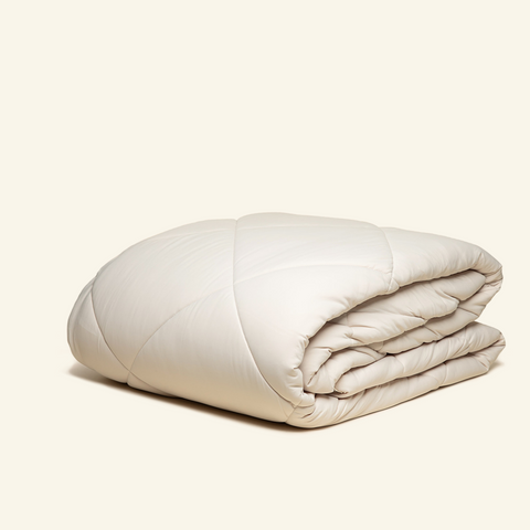 The All-season UltraCool Comforter folded in the sand color