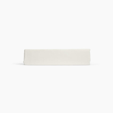 Avec linen classic top sheet in bone folded neatly on a white background