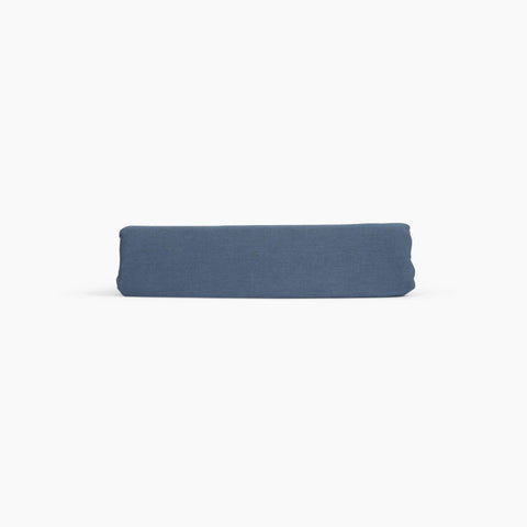 Avec linen classic top sheet in harbor folded neatly on a white background