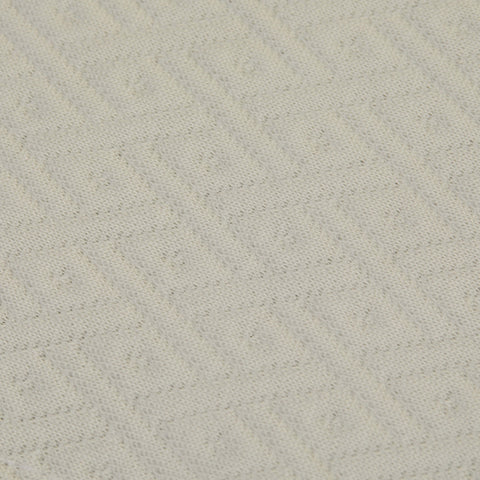 A detailed view of the top fabric on the Slumber Cloud Core Mattress Protector - Crib