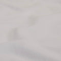 A detailed view of the fabric of the Slumber Cloud Essential Fitted Sheet - Crib
