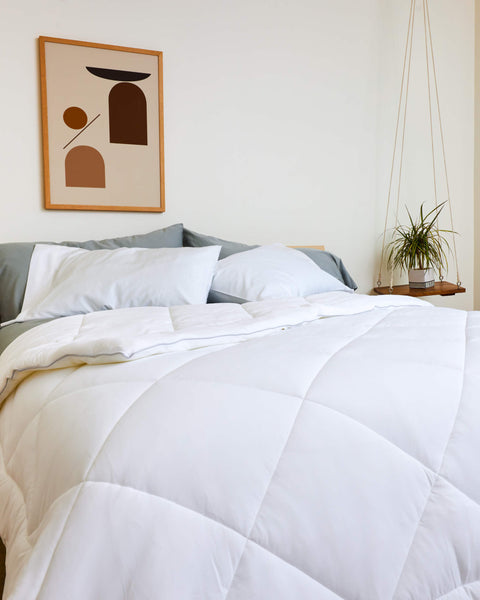 A simple bed made with the Slumber Cloud UltraCool Comforter