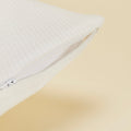 A close up of the zipper on the Slumber Cloud Performance Pillow Cover Set made with Outlast temperature regulation technology on a moisture wicking fabric 