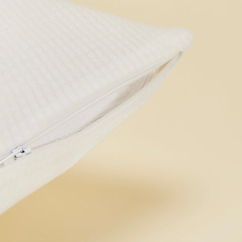 A close up of the zipper on the Slumber Cloud Performance Pillow Cover Set made with Outlast temperature regulation technology on a moisture wicking fabric 