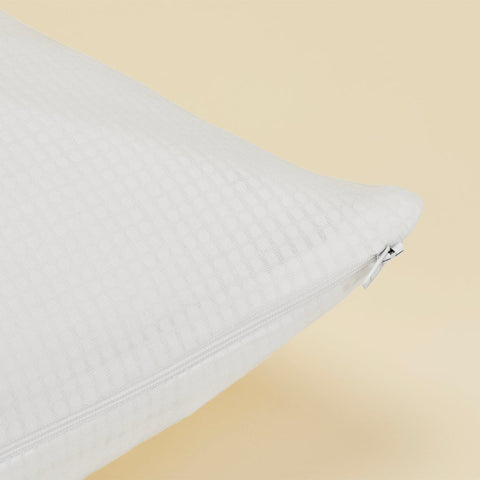 A close up of the zipper on the Slumber Cloud Performance Pillow Cover Set made with Outlast temperature regulation technology on a moisture wicking fabric 
