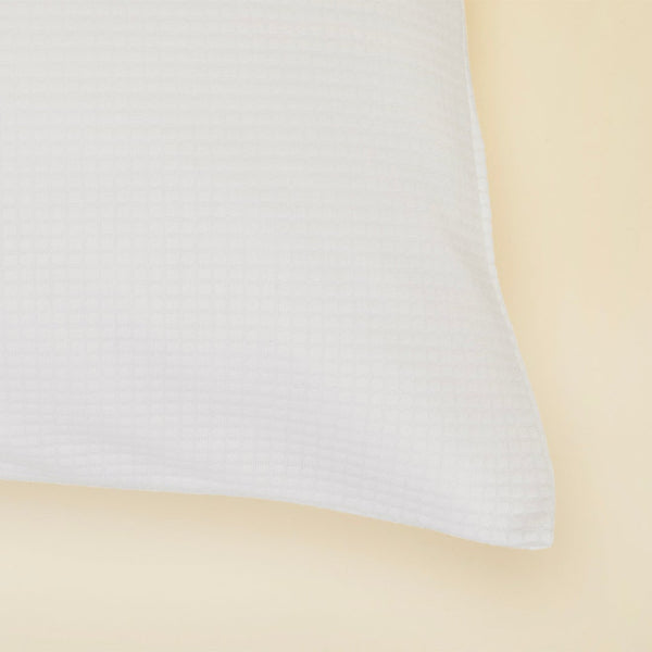 A close up of the Slumber Cloud Performance Pillow Cover Set made with Outlast temperature regulation technology on a moisture wicking fabric 