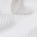 A close up of the Slumber Cloud Performance Pillow Cover Set made with Outlast temperature regulation technology on a moisture wicking fabric 