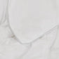 Detailed view of the piping on the Slumber Cloud UltraCool Comforter takes the ClimaDry™ by Outlast and pairs it with an 89% cooling nylon and 11% spandex outer cover that mimics silk creating the silky smooth and soft to the touch hand feel.