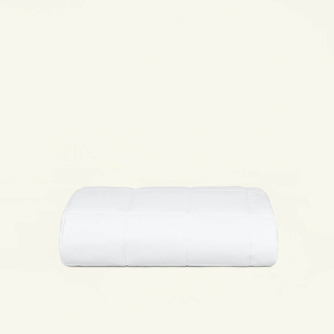 The white colored Slumber Cloud Core Mattress Pad made with temperature regulation technology