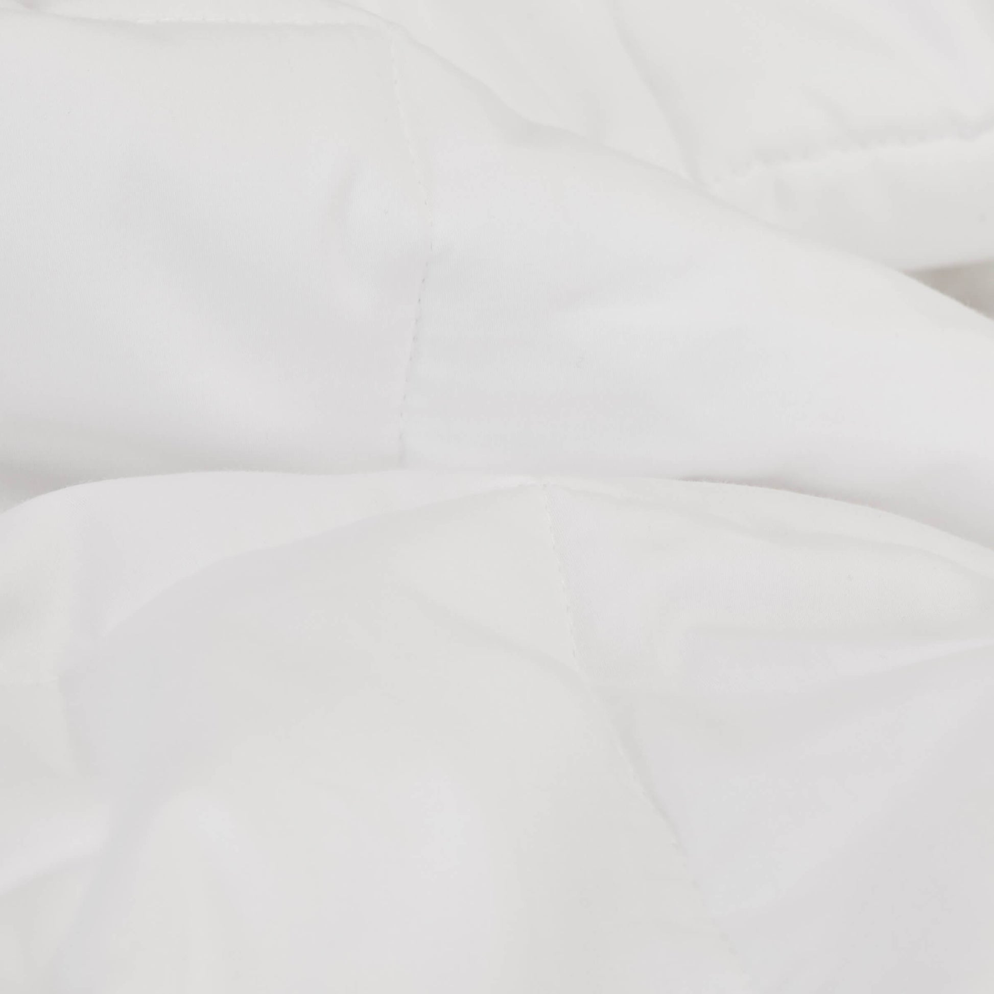 A detailed view of the Slumber Cloud Comforter fabric with temperature regulating technology