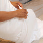 A man putting a pillowcase over a Slumber Cloud Core Down Alternative Pillow