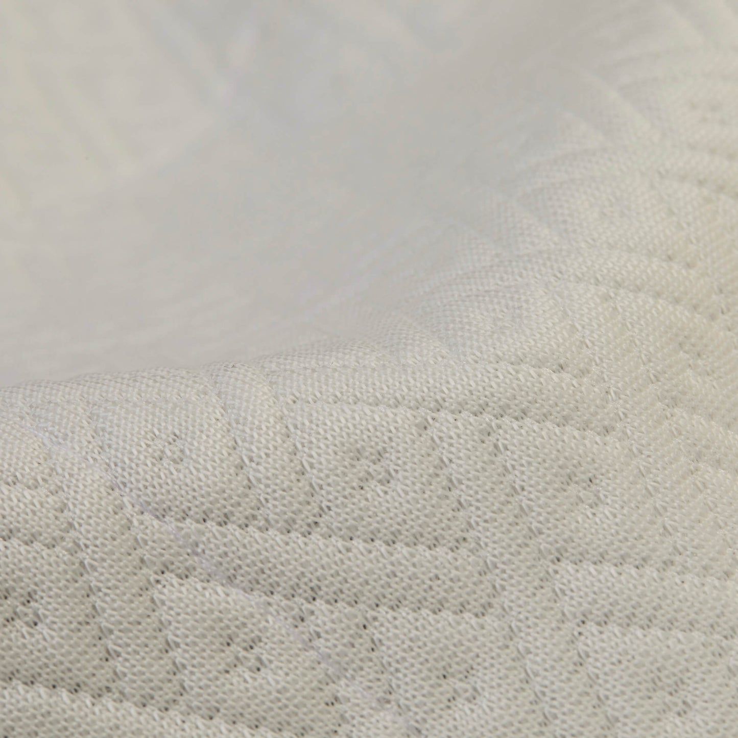 A close up of the fabric details on the Slumber Cloud Core Mattress Protector