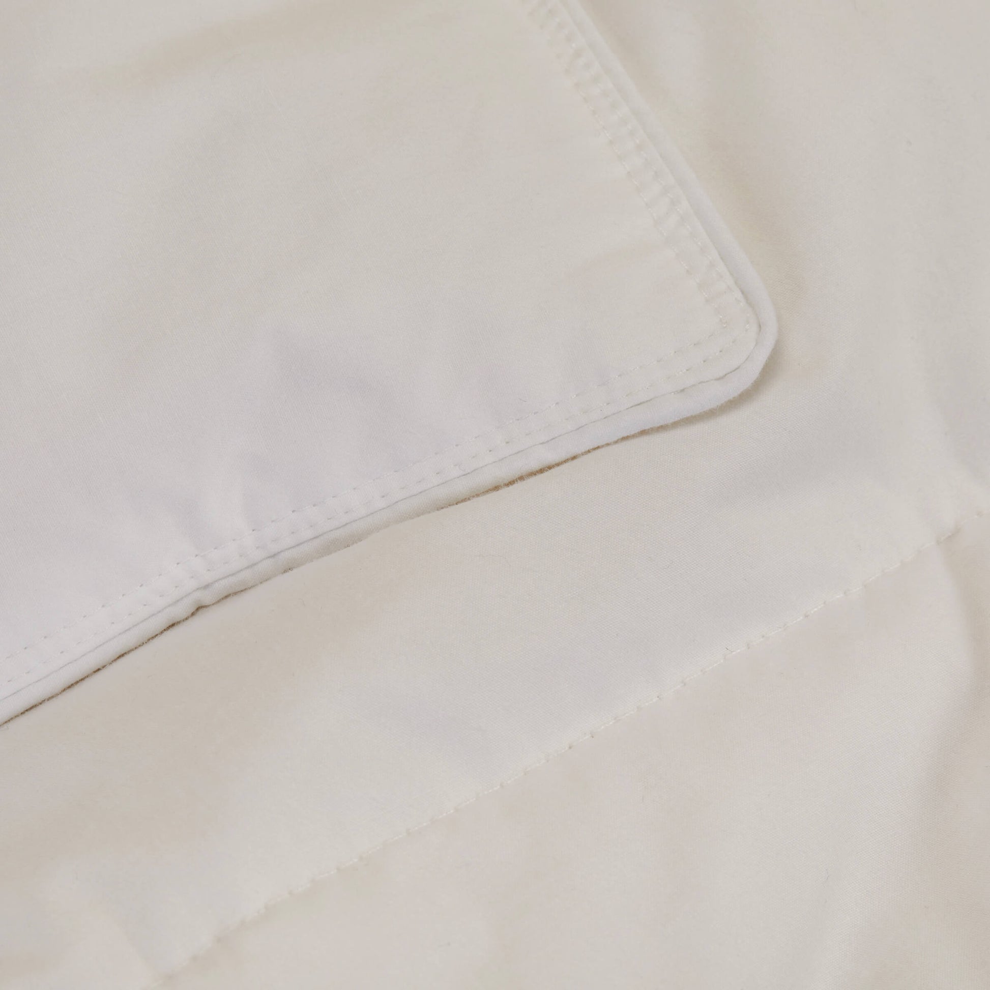 A close up shot of the fabric details on the Slumber Cloud Down Comforter