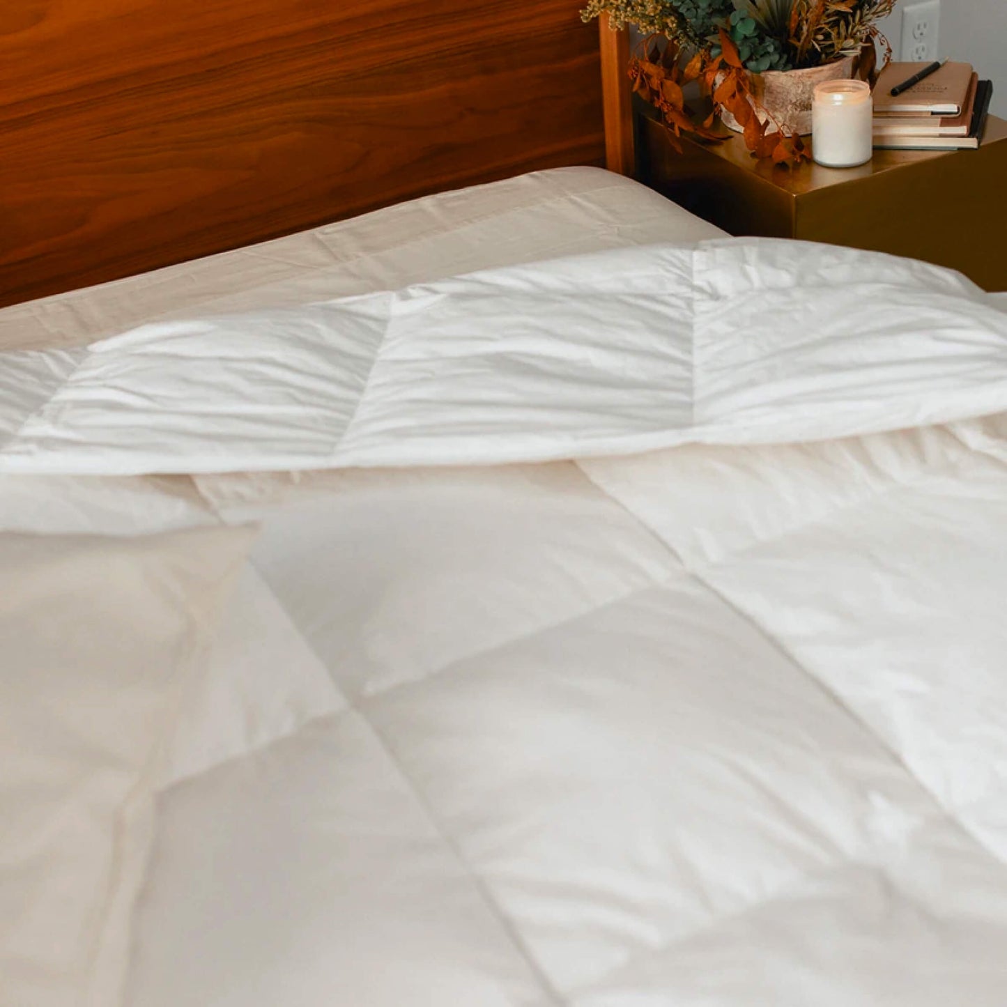 A modern bedroom with the Slumber Cloud Down Comforter made with temperature regulation technology