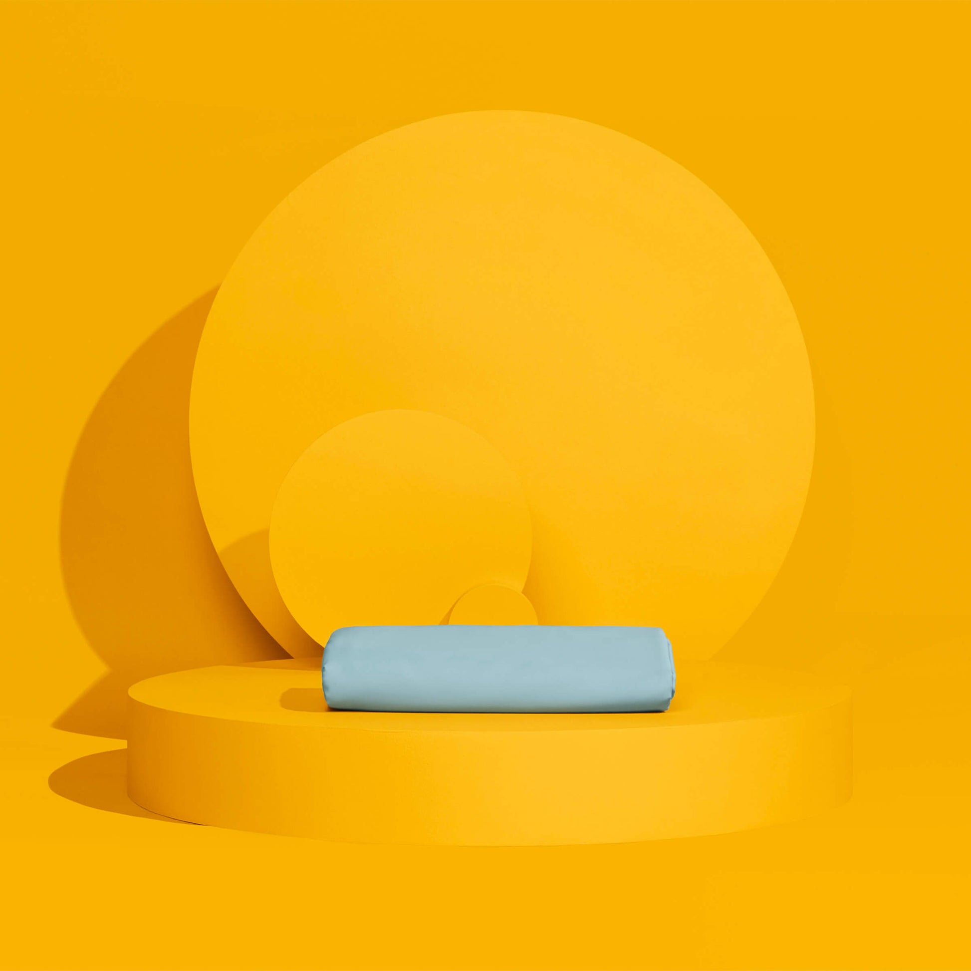 The Slumber Cloud Essential Duvet Cover with temperature regulation technology folded and propped on a yellow background
