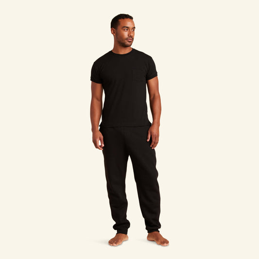 Man wearing the Slumber Cloud Essential Pocket Tee made with Outlast® temperature regulation technology to help keep you cool and comfortable throughout the night