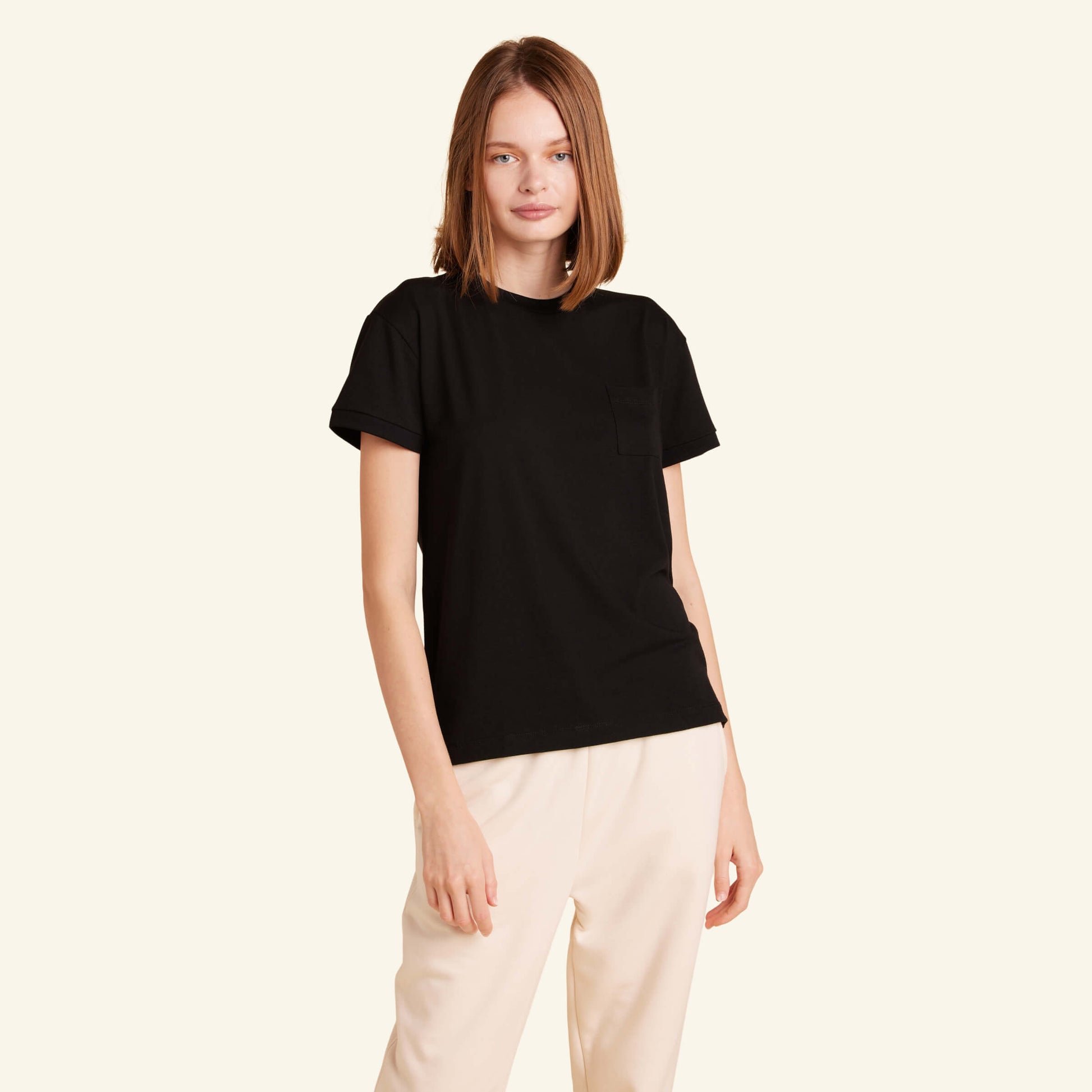 Woman wearing the Slumber Cloud Essential Pocket Tee made with Outlast temperature regulation technology