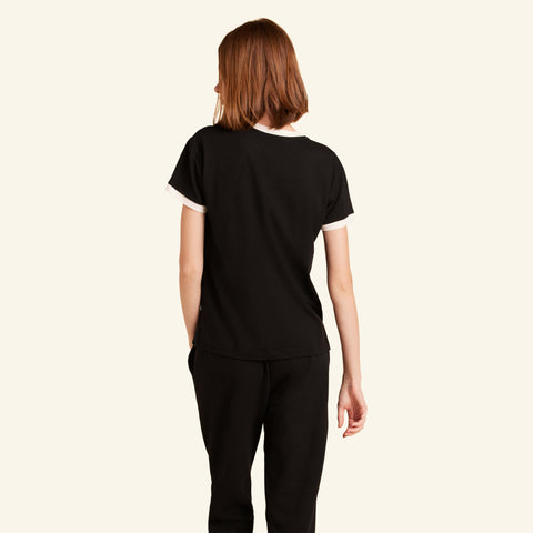 Woman wearing the Slumber Cloud Essential Pocket Tee made with Outlast temperature regulation technology