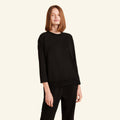 Woman wearing the Slumber Cloud Essential Raglan Long Sleeve made with Outlast temperature regulation technology