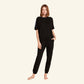 Woman wearing the Slumber Cloud Essential Raglan Pullover made with Outlast temperature regulation technology