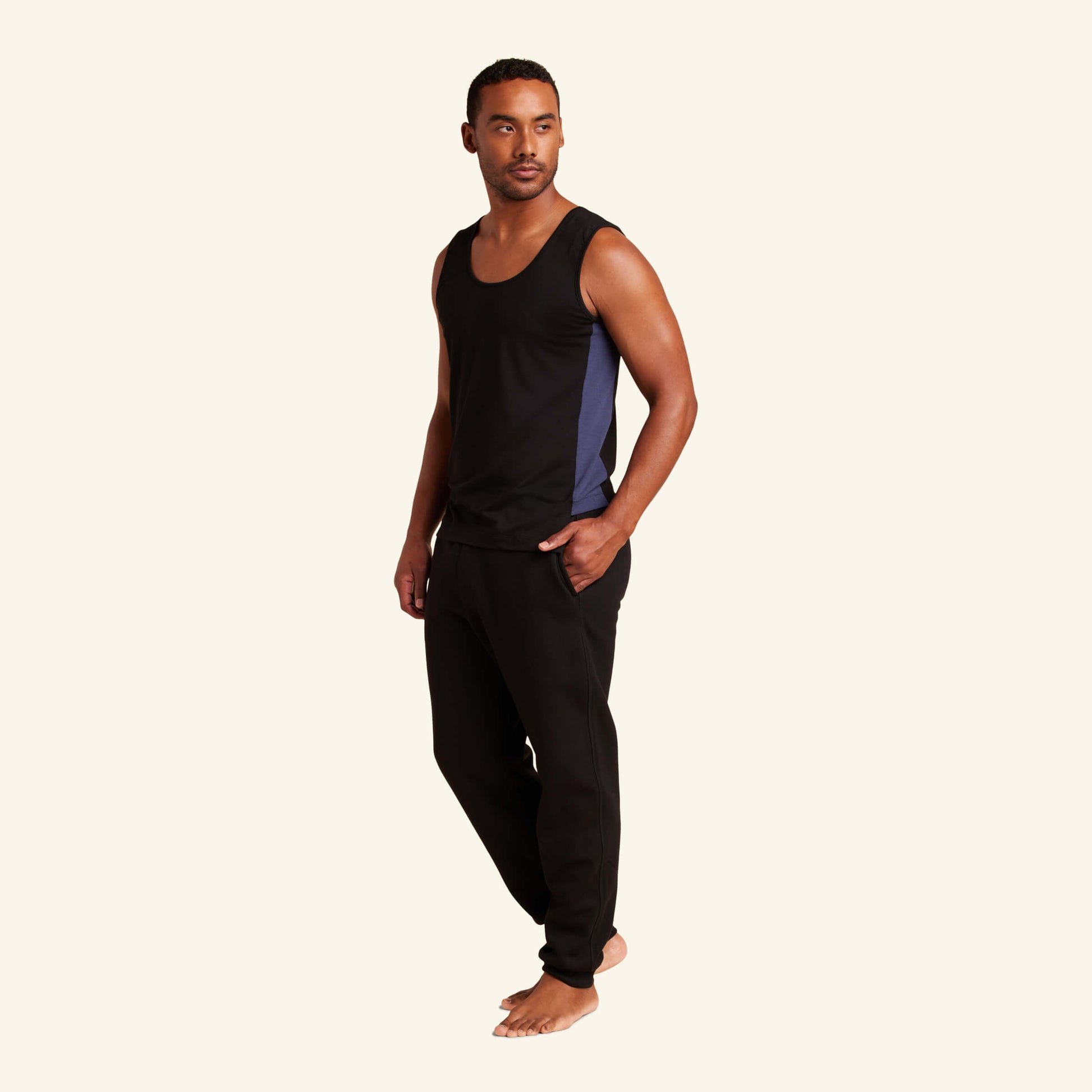 Man wearing the Slumber Cloud Essential Tank made with Outlast® temperature regulation technology to help keep you cool and comfortable throughout the night