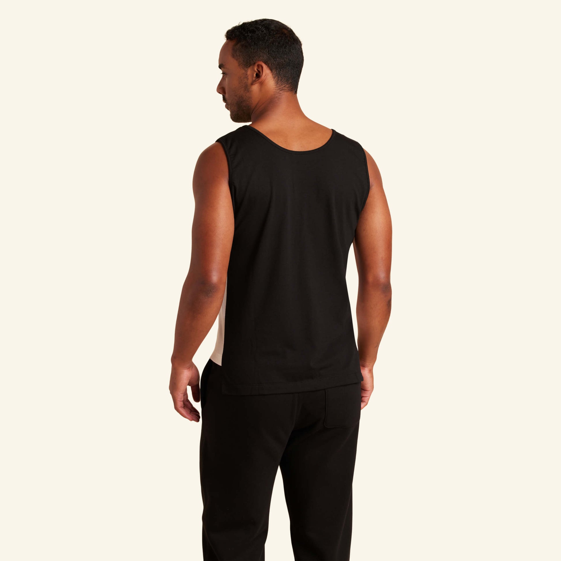 Man wearing the Slumber Cloud Essential Tank made with Outlast temperature regulation technology