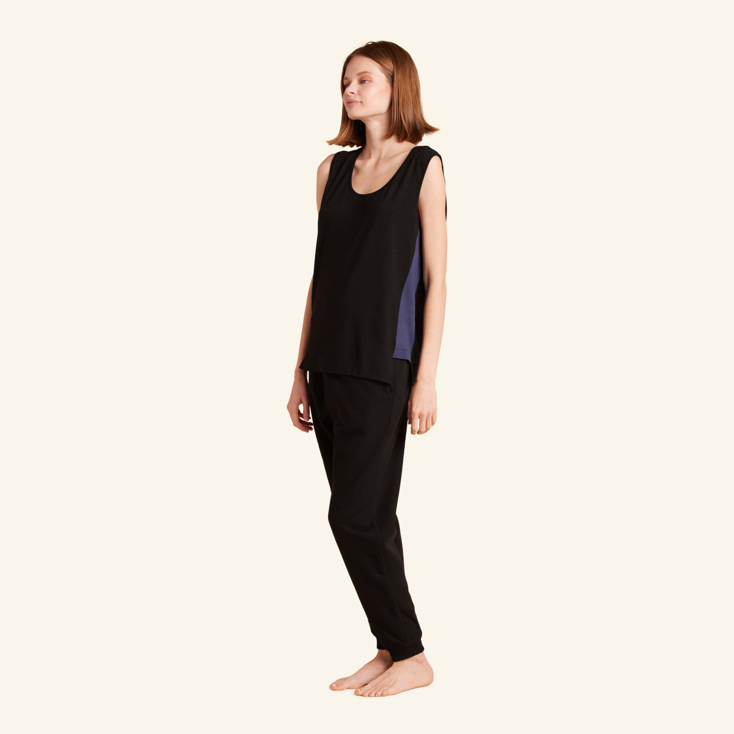 Woman wearing the Slumber Cloud Essential Tank made with Outlast temperature regulation technology