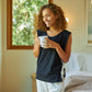 Woman wearing the Slumber Cloud Essential Tank made with Outlast temperature regulation technology