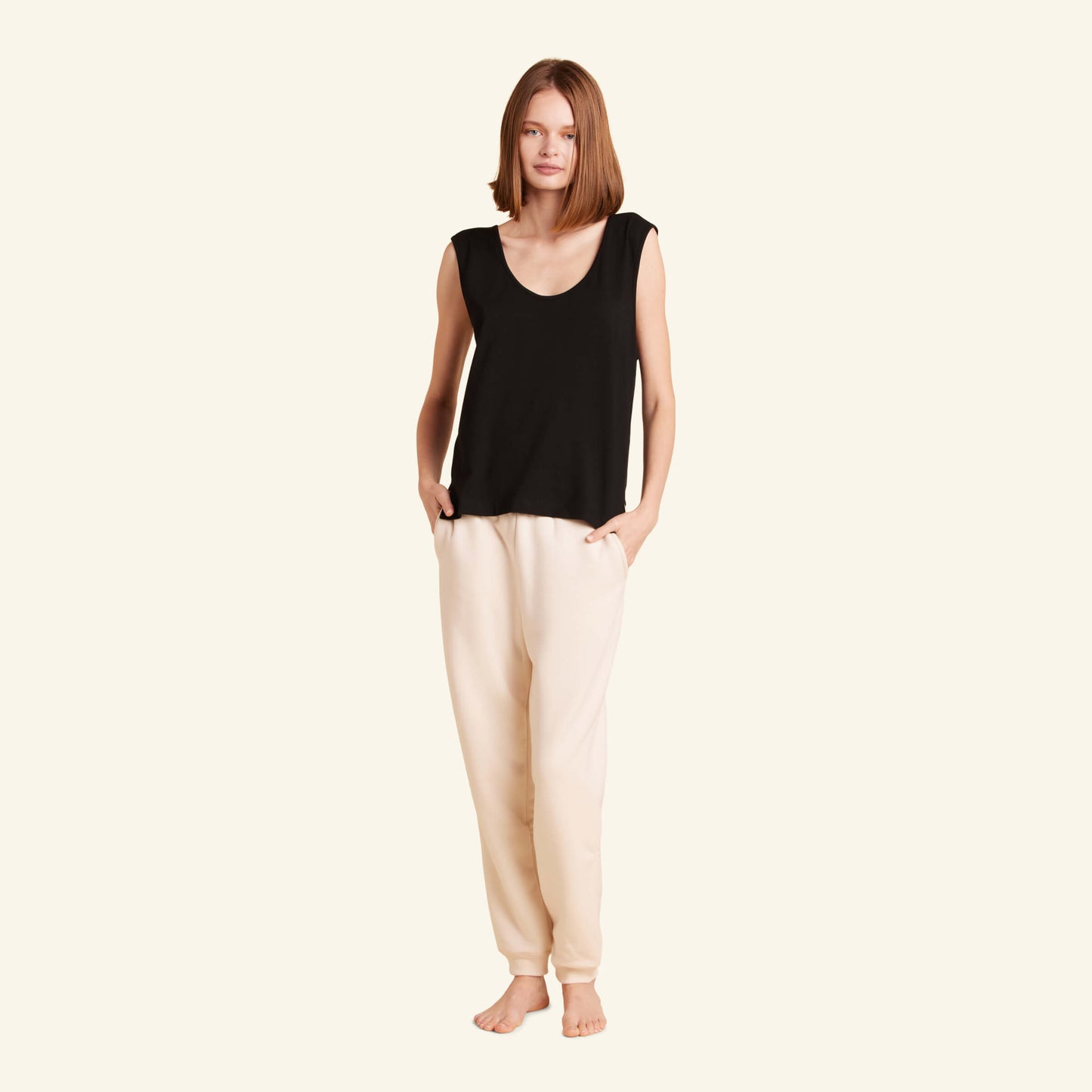 Woman wearing the Slumber Cloud Essential Tank made with Outlast temperature regulation technology