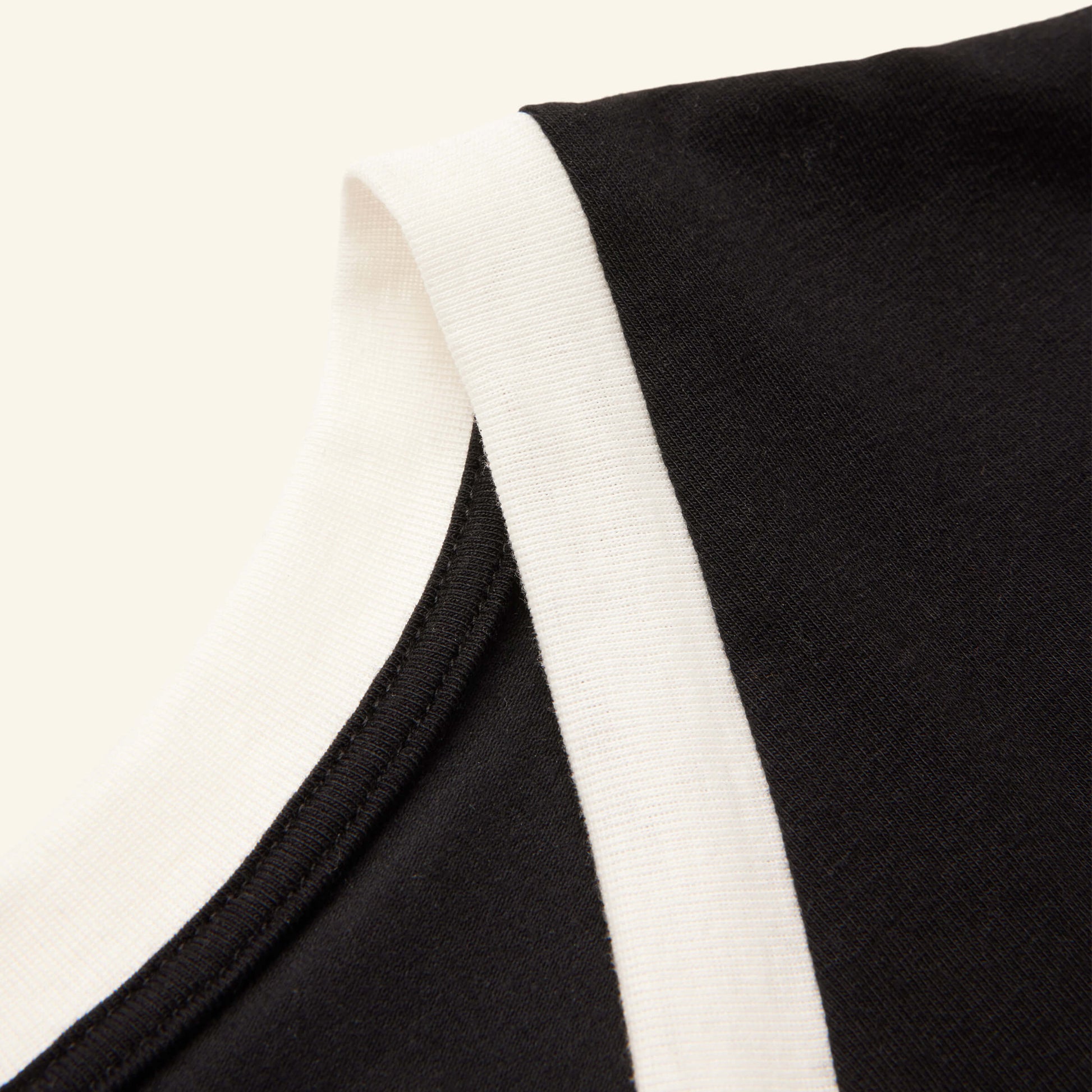 Detailed view of the Slumber Cloud Essential V-Neck made with Outlast temperature regulation technology