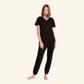Woman wearing the Slumber Cloud Essential V-Neck made with Outlast temperature regulation technology