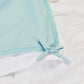 Detailed view of the corner loops on the Slumber Cloud Lightweight Comforter made with Outlast temperature regulation technology to help you stay cool through the night. | Cooling Technology