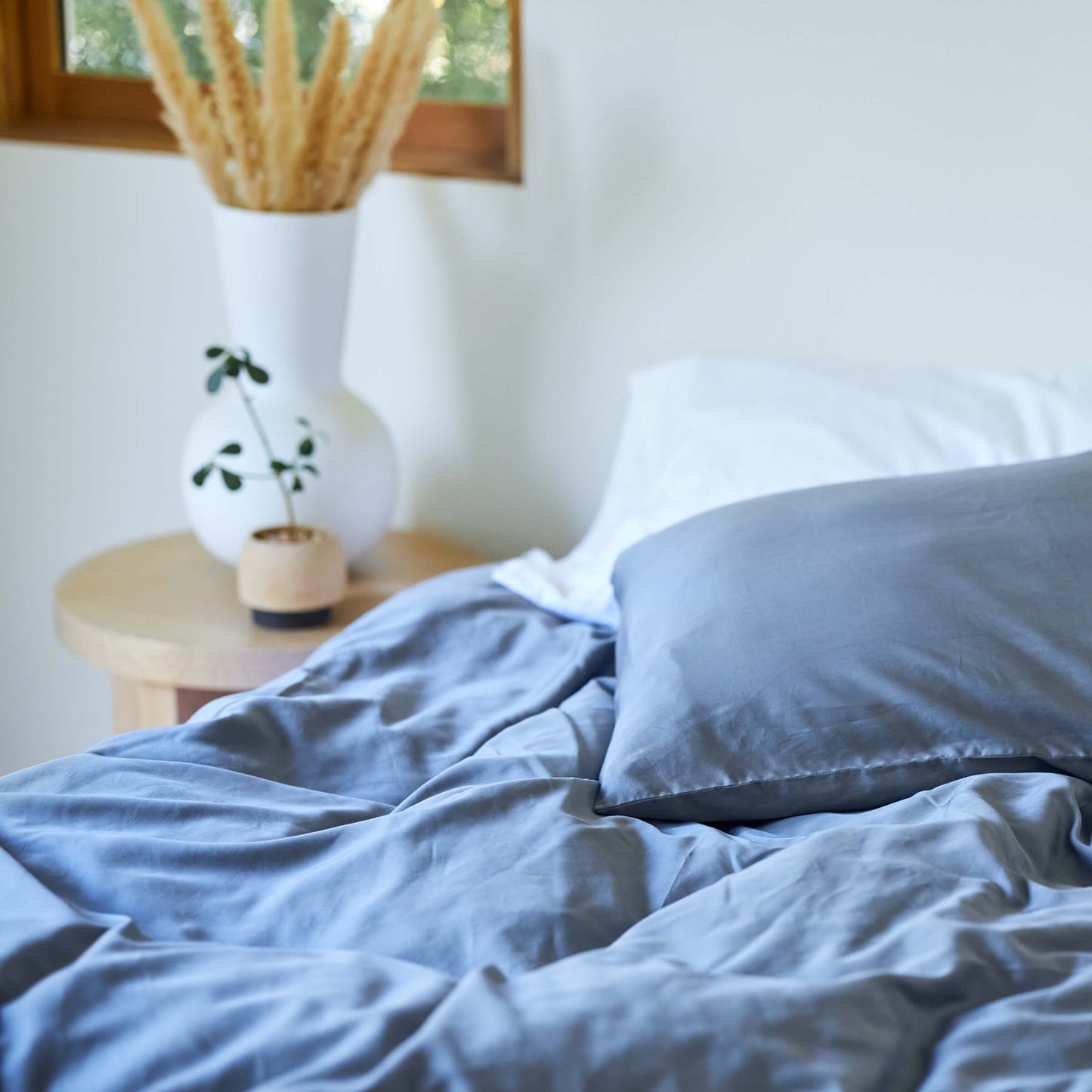 Natural light on bed with the Slumber Cloud Performance Duvet Cover with temperature regulation technology and Tencel in the morning.