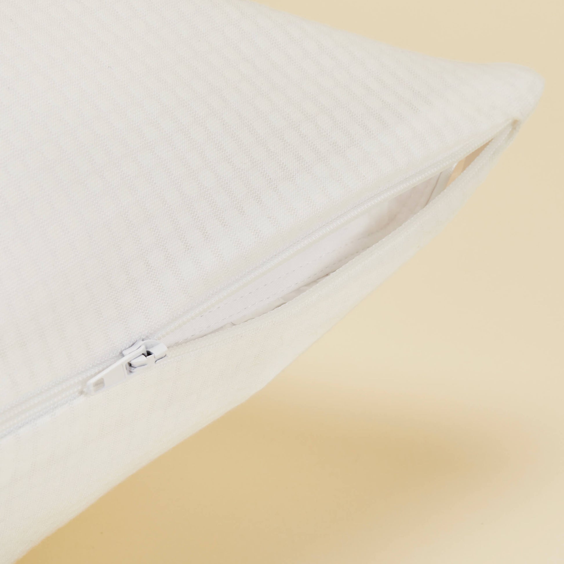 Detailed view of the zipper on the Slumber Cloud Performance Pillow Cover made with Outlast Temperature Regulation Technology