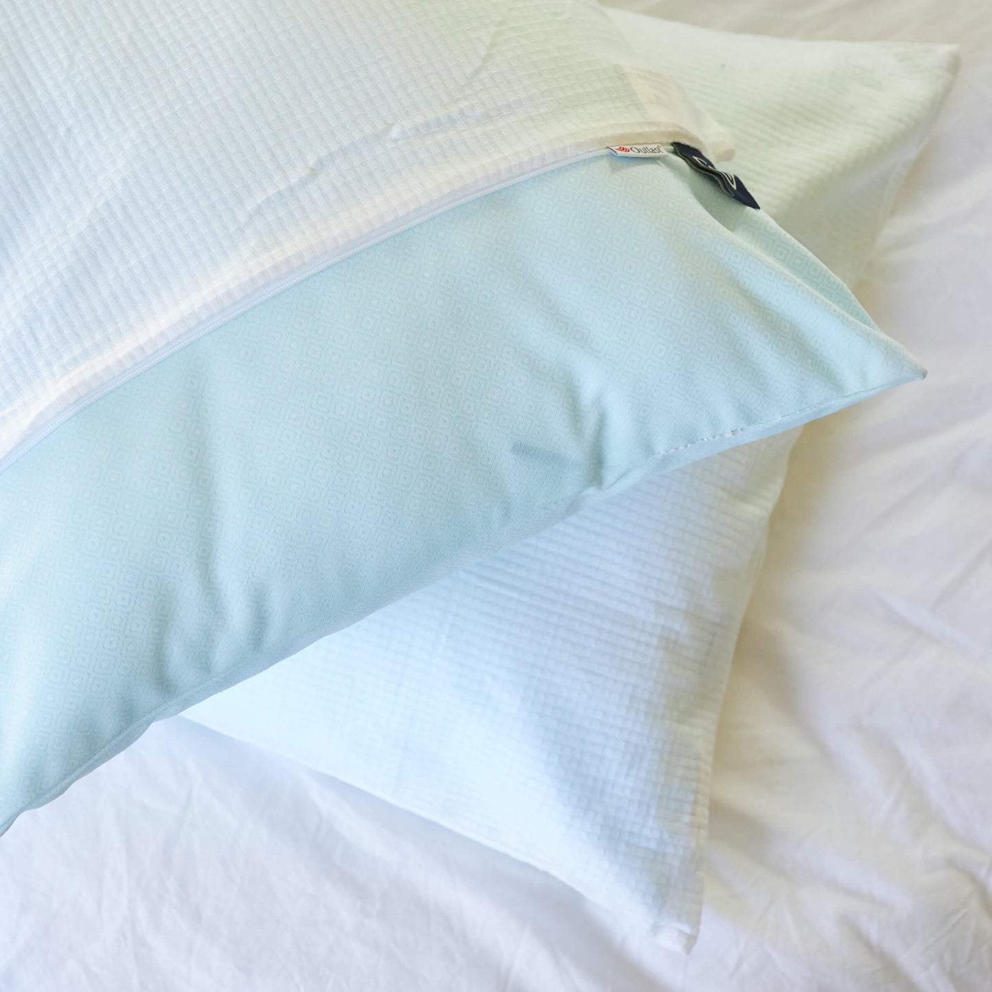 The Slumber Cloud Performance Pillow Bundle, consisting of two UltraCool Pillows and a set of Performance Pillow Covers all made with Outlast Temperature regulation technology