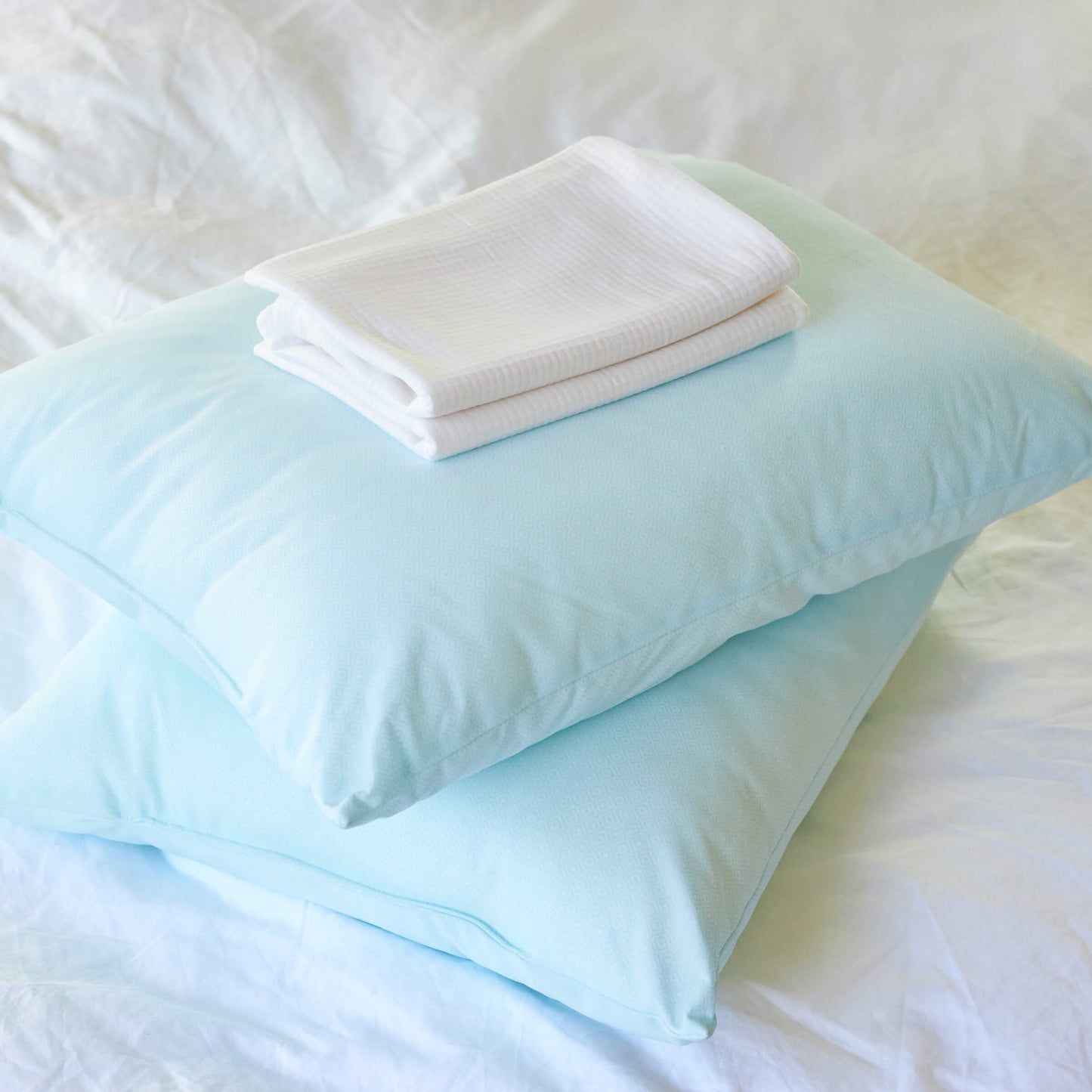The Slumber Cloud Performance Pillow Bundle, consisting of two UltraCool Pillows and a set of Performance Pillow Covers all made with Outlast Temperature regulation technology