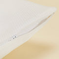 A detailed view of the zipper on the Slumber Cloud Performance Pillow Cover with Outlast temperature regulation technology