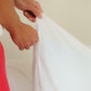 A man zipping up the Slumber Cloud Performance Pillow Cover with Outlast temperature regulation technology