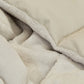 Detailed view of the Slumber Cloud Plush Throw Blanket made with Outlast Temperature regulation technology in fog