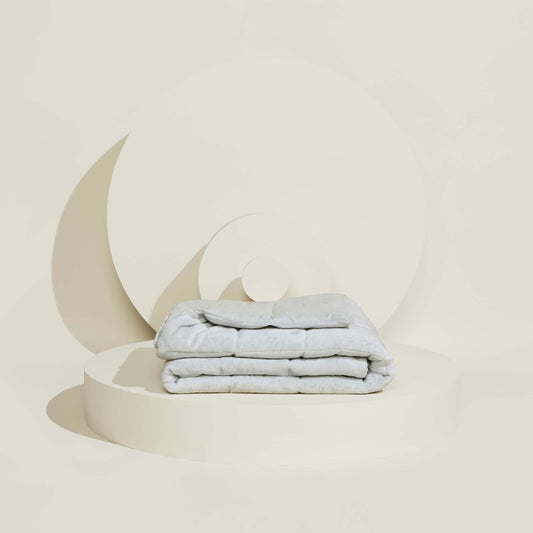 The Slumber Cloud Plush Throw Blanket with Outlast® temperature regulation technology to help keep you cool and comfortable throughout the night