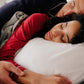Man and woman sleeping on the Slumber Cloud Silk Pillowcase made with temperature regulation technology
